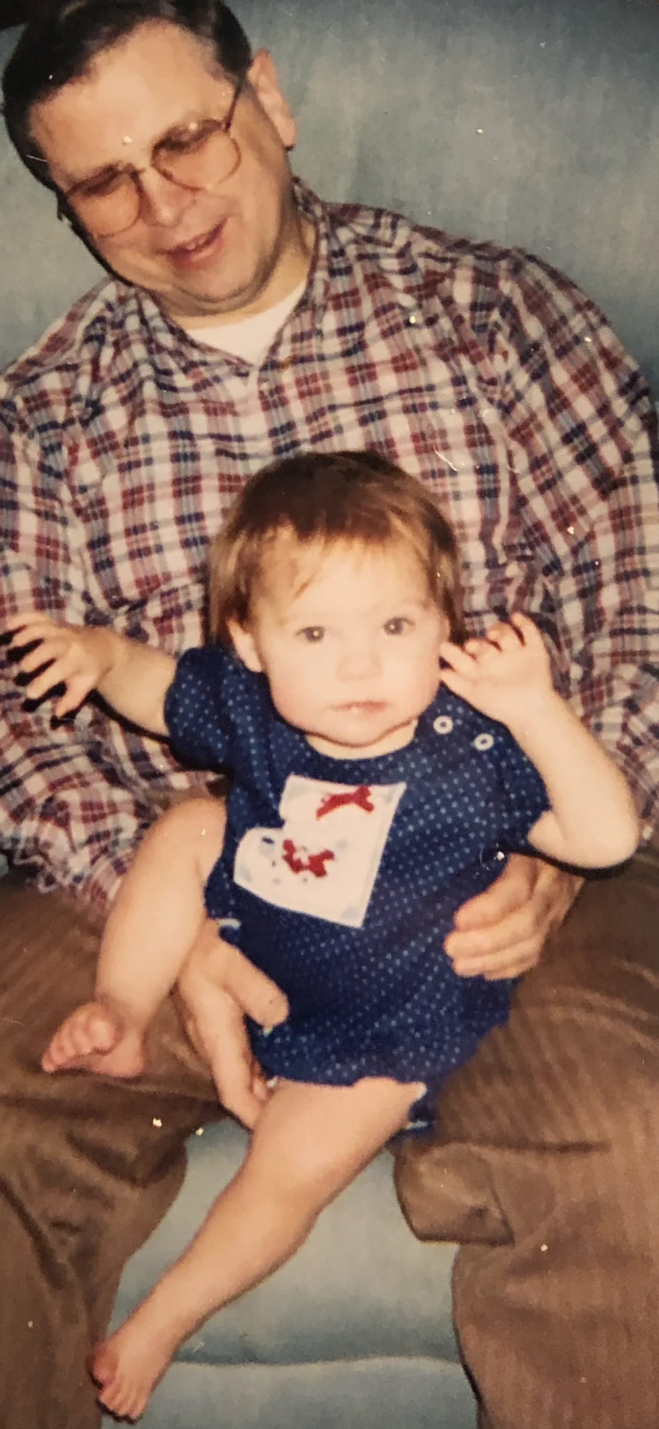 Alicia as a baby with her granddad